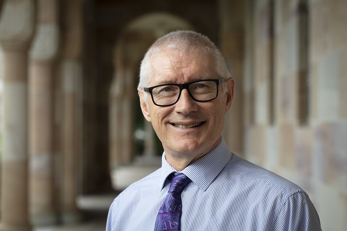 Professor Matthew Morell standing inside the sandstone of UQ's Great Court