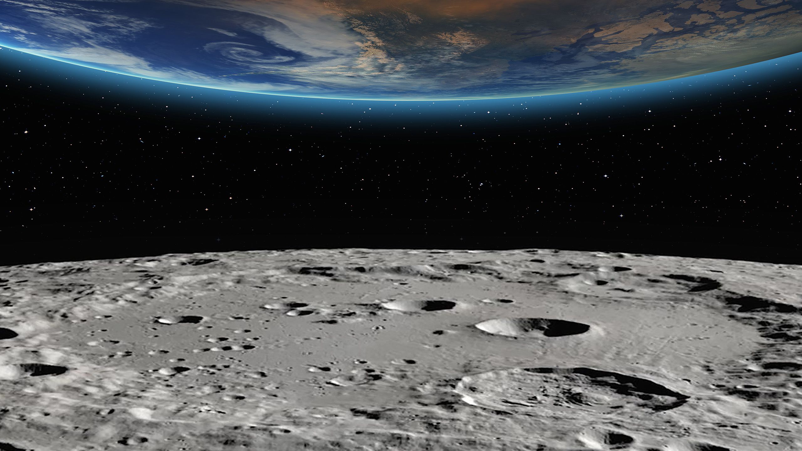 The surface of the moon and the edge of the earth in space