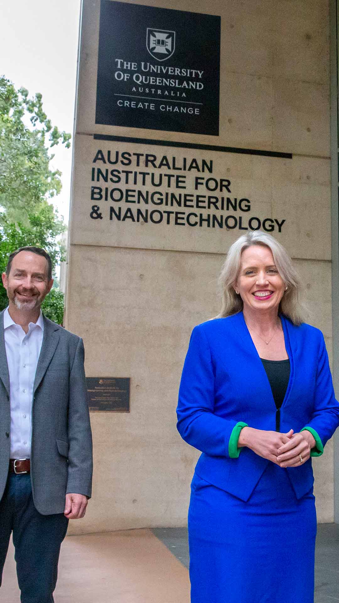 Professor Trent Munro and Hon Kate Jones standing outside the Australian Institute for Bioengineering and Nanotechnology