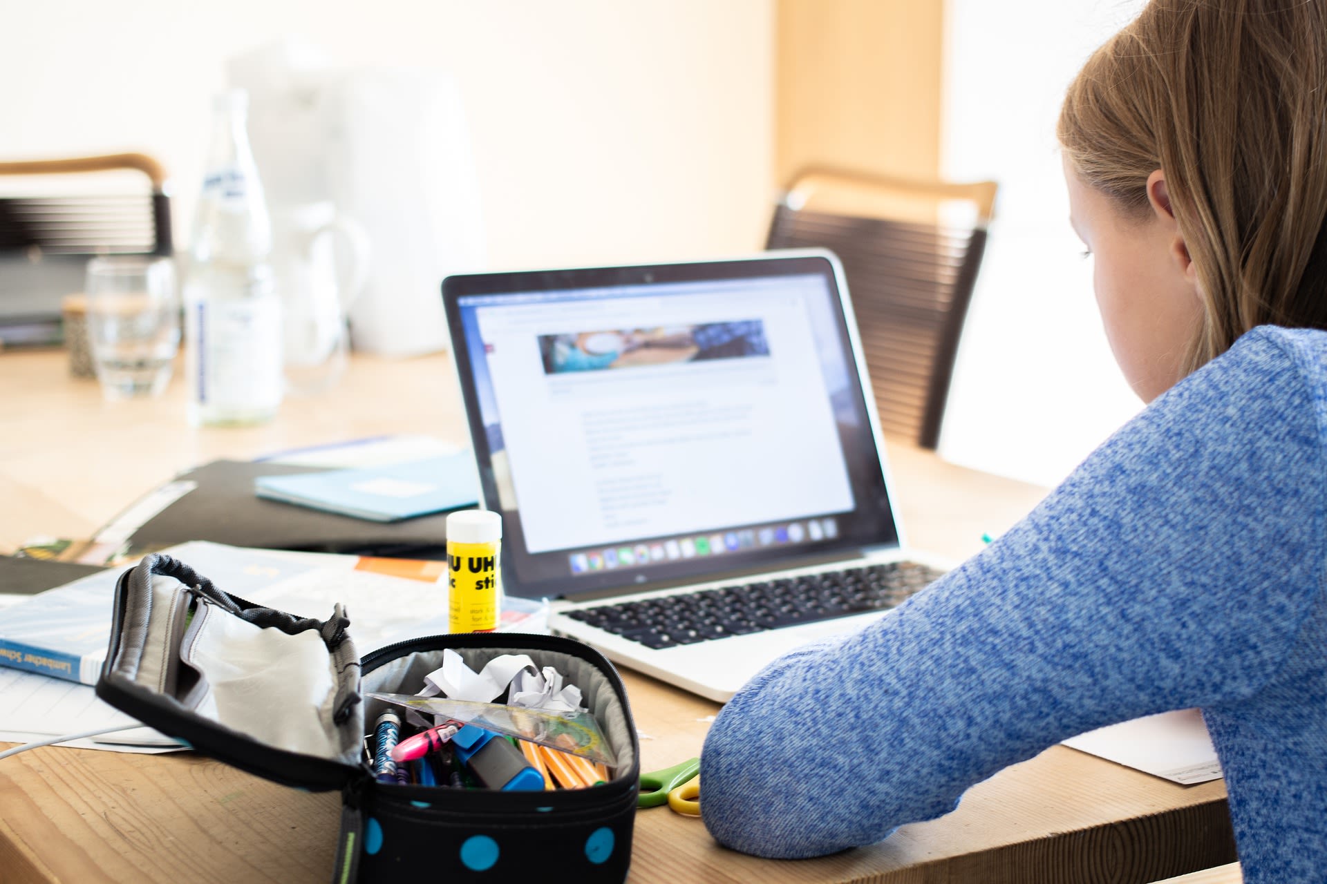 Image of three students studying.