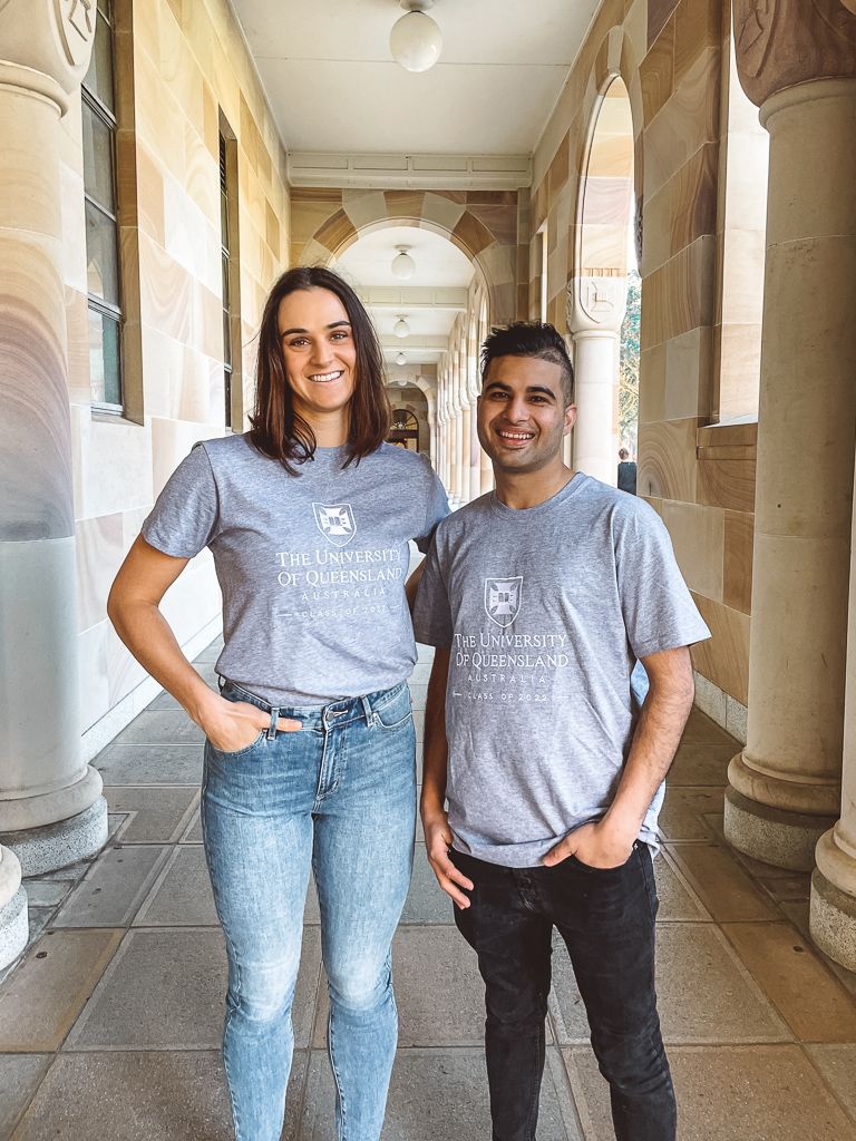 Two UQ female students wearing UQ Shop apparel