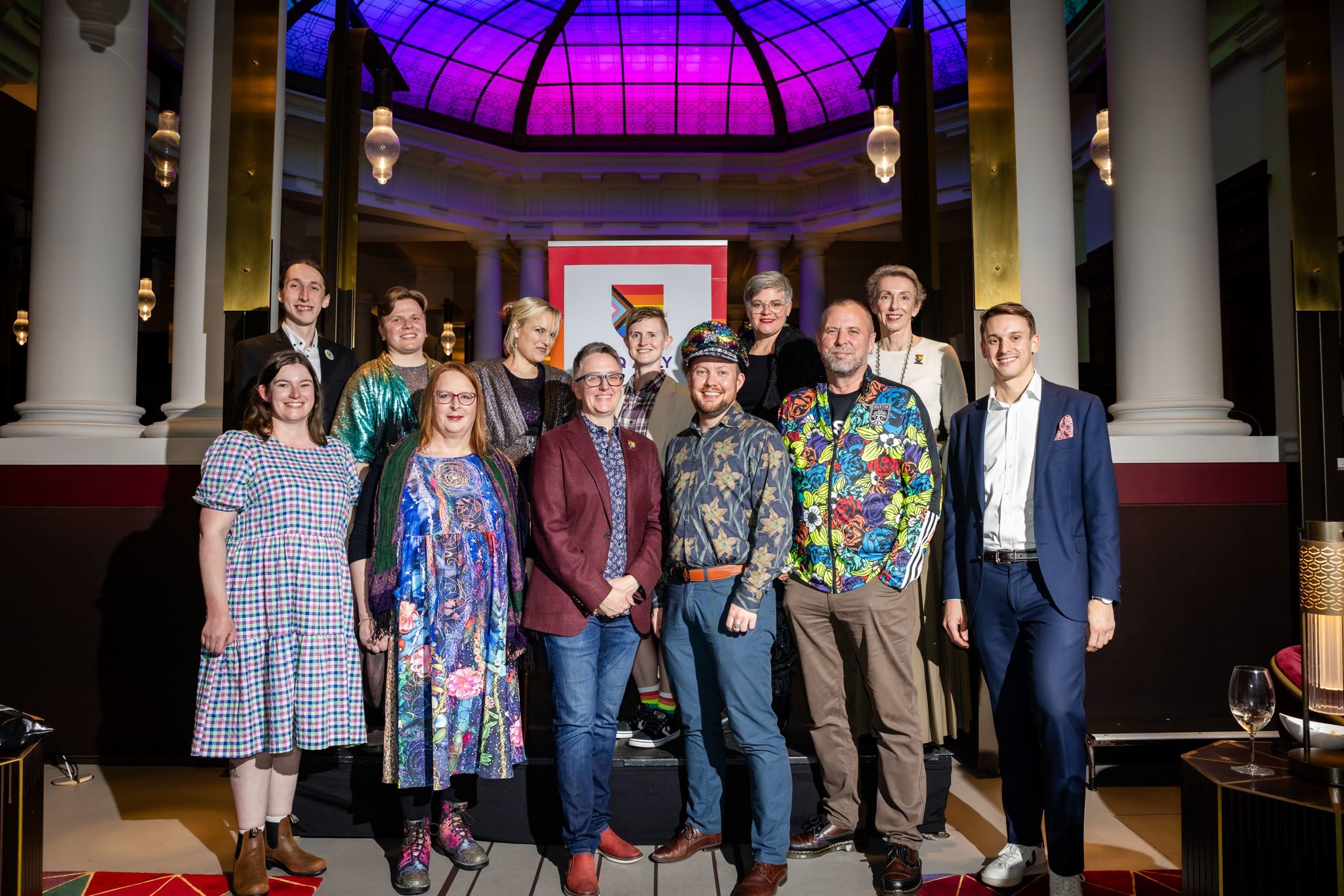 A group of people at a function in support of the LGBTQIA+ community.