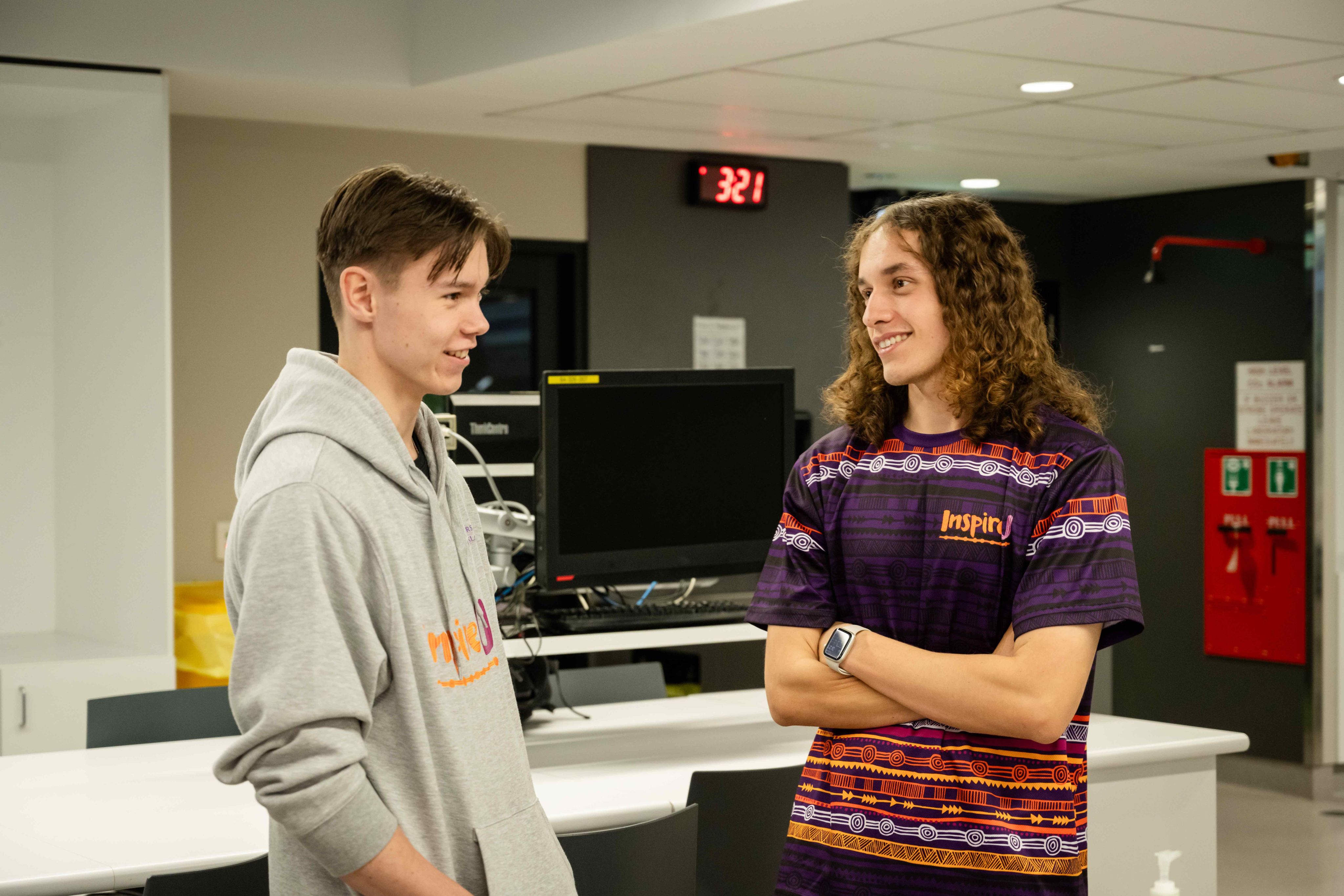 Angus (right) talks to an InspireU student.