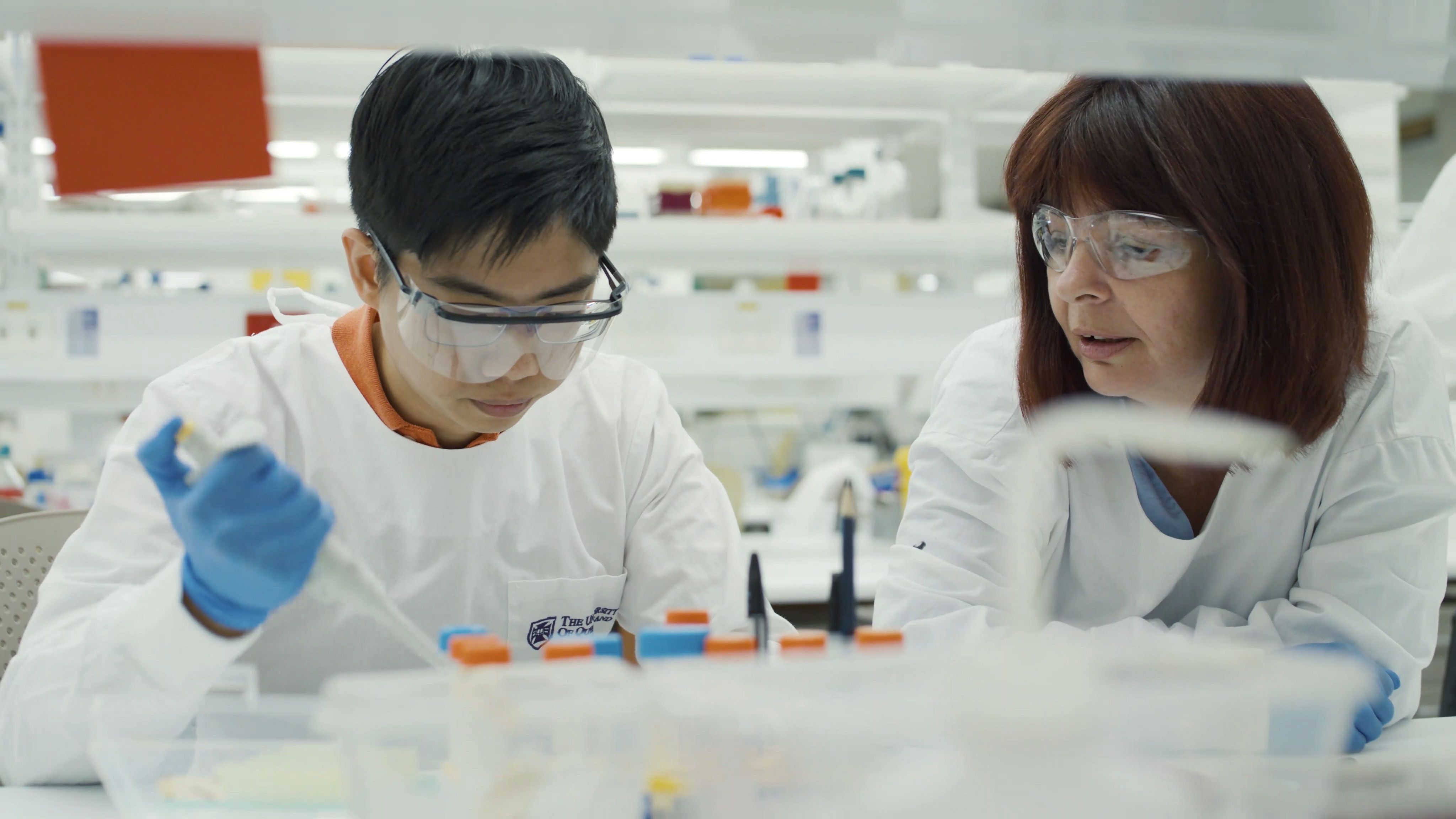 Professorial Research Fellow Professor Fiona Simpson and her colleague conduct laboratory research.