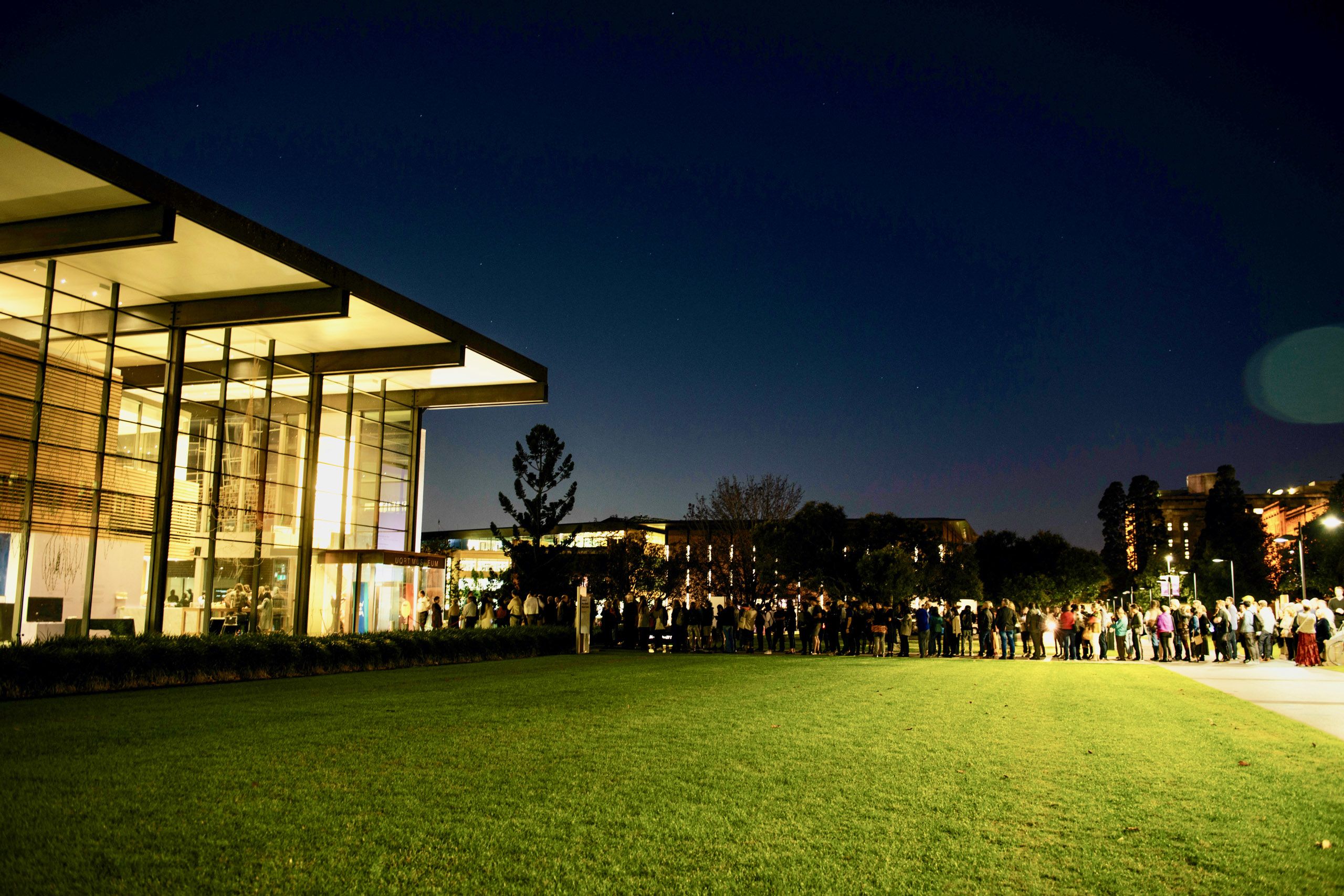 A long line of people outside UQ Art Museum waiting to come inside for the Unlearning opening celebration.