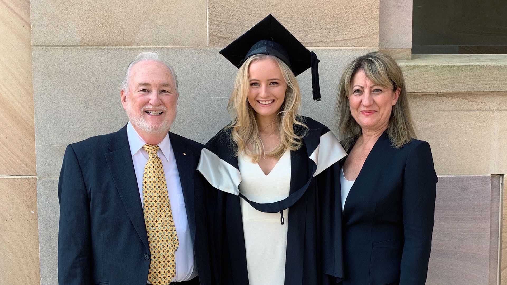 Family photograph graduation, graduation gown.