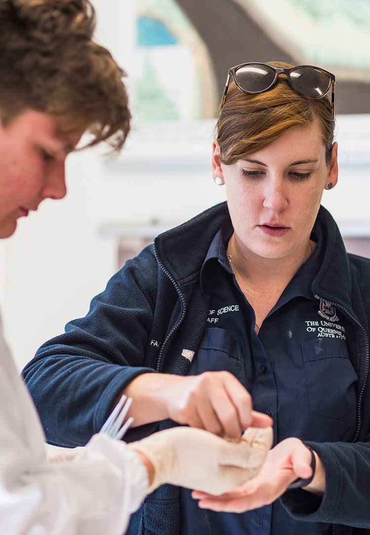 This is an image of Heron Island Research Station Scientific Officer Abbie Taylor working with a student from The Cathedral College Rockhampton as part of the Live Learning Program.