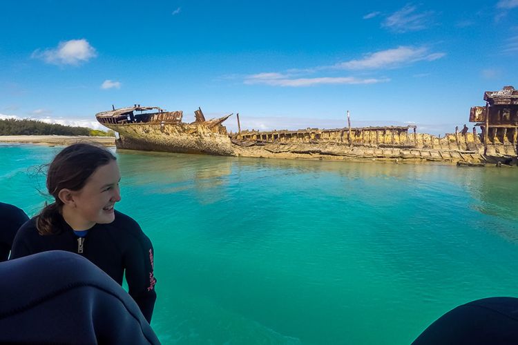 This is an image of Students at the wreck of HMCS Protector off Heron Island.