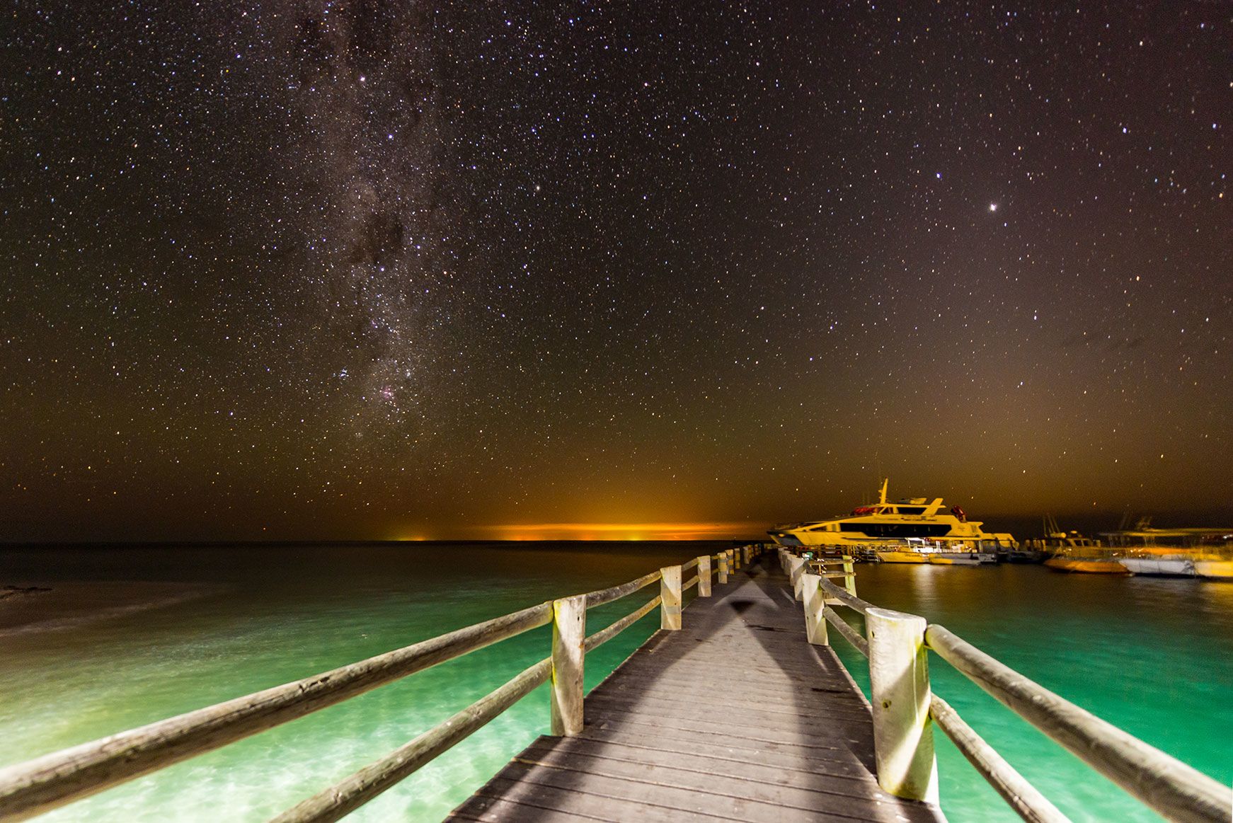 This is an image of the Heron Island jetty at night time.