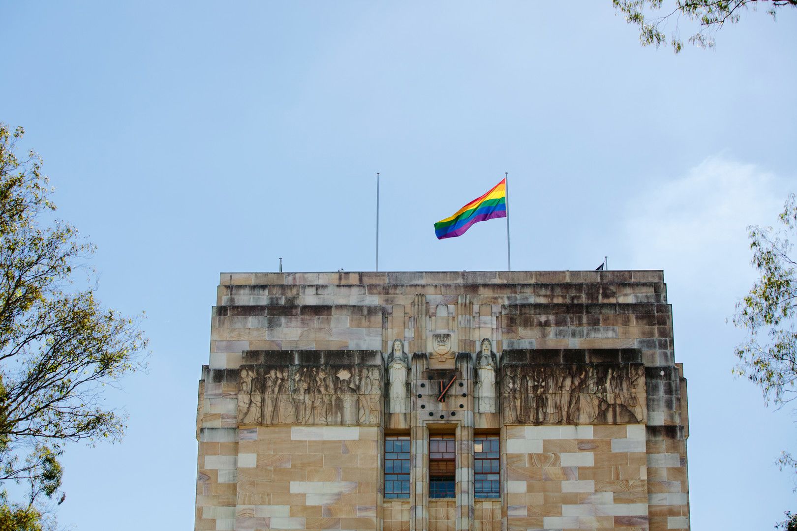 The Pride flag flies on the Forgan Smith building at UQ's St Lucia campus.