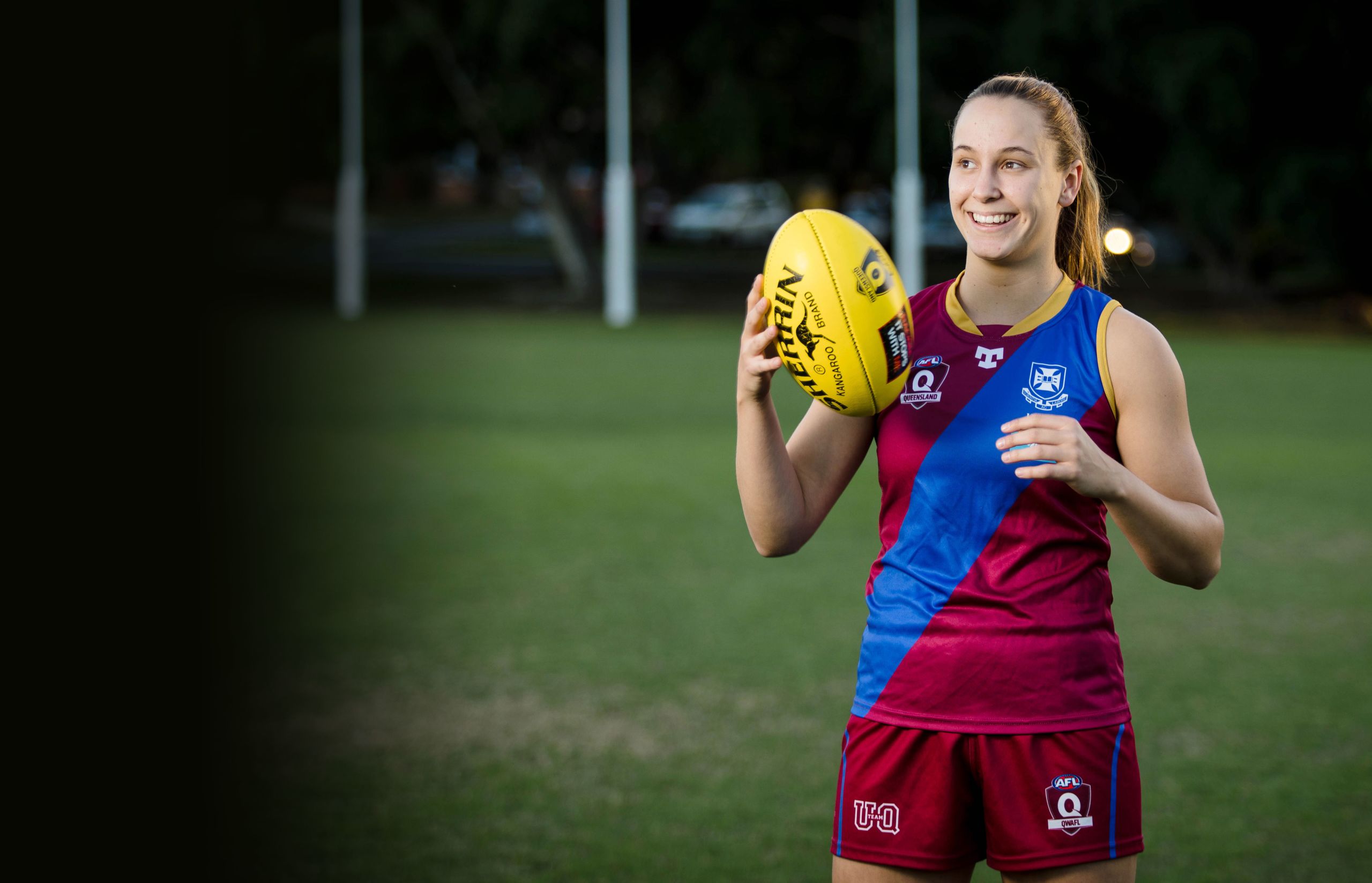 This is an image of UQ student and AFLW player Natalie Grider at the UQ AFL fields.
