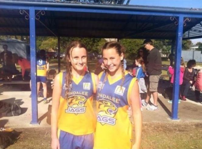 This is an image of Natalie Grider (right) during her junior football days with the Jindalee Jags.