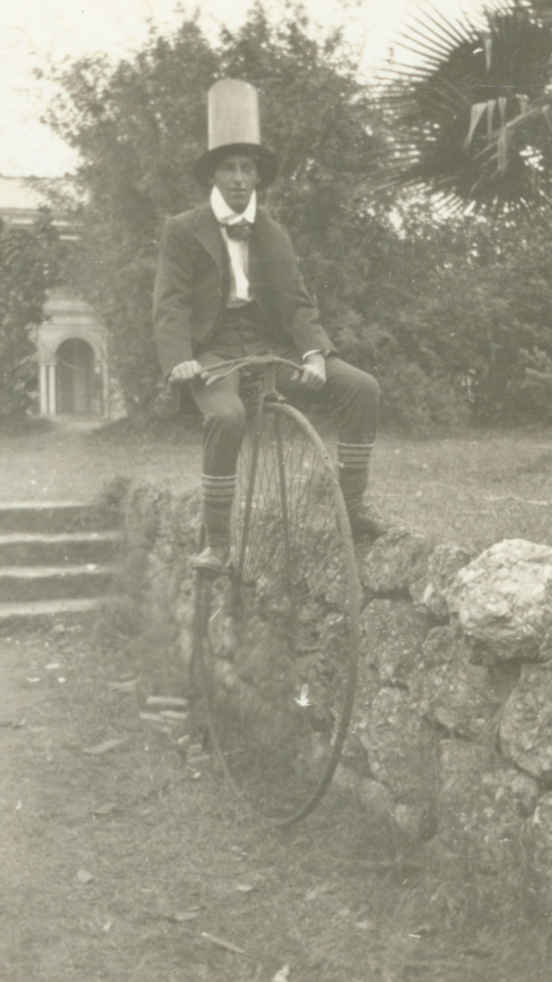 An image of N.F. George on a penny farthing bicycle at UQ in 1919.