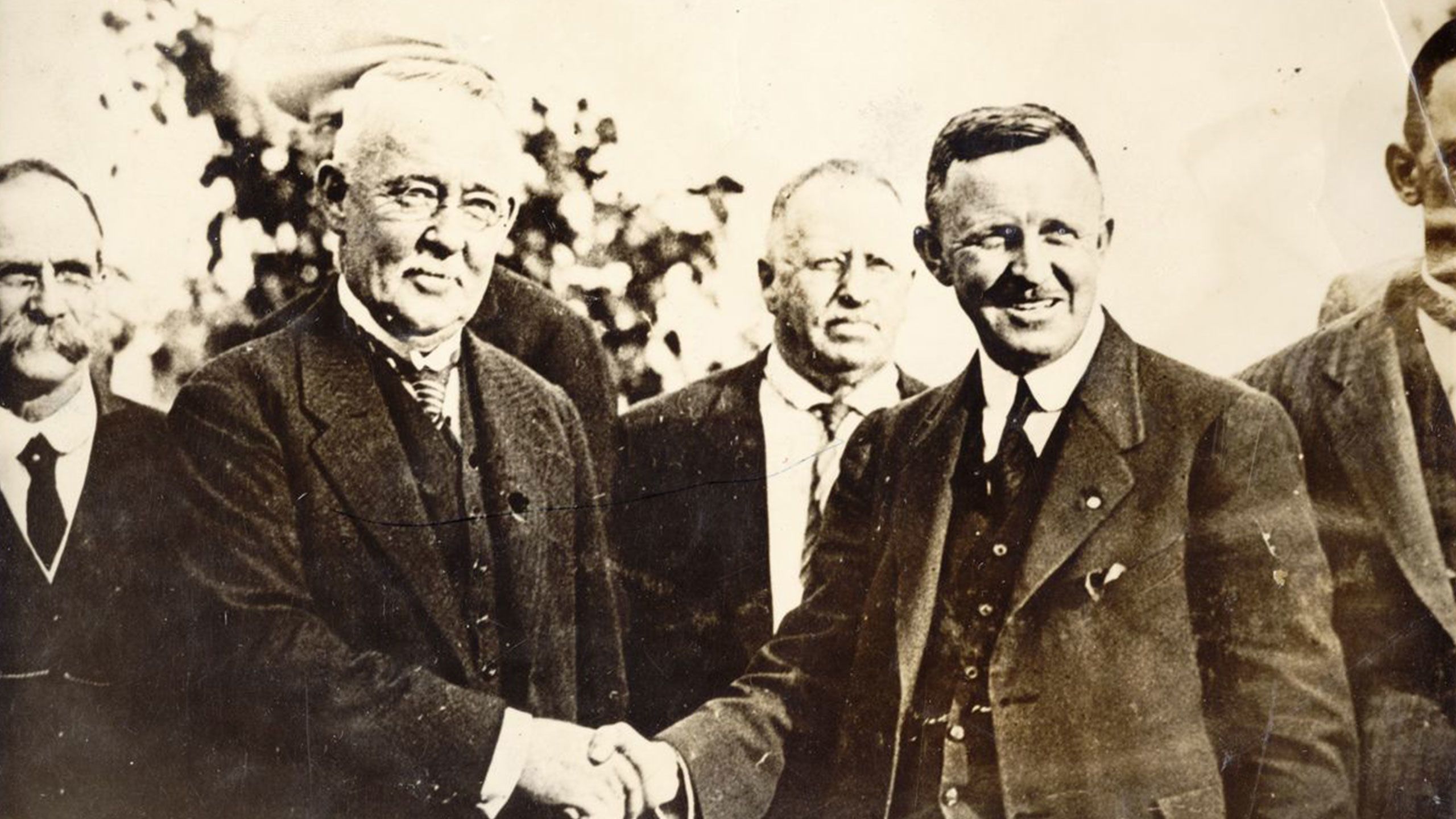 An image of Dr James Mayne handing over the gift used to acquire the land at St Lucia for UQ to Alderman William Jolly in 1926.