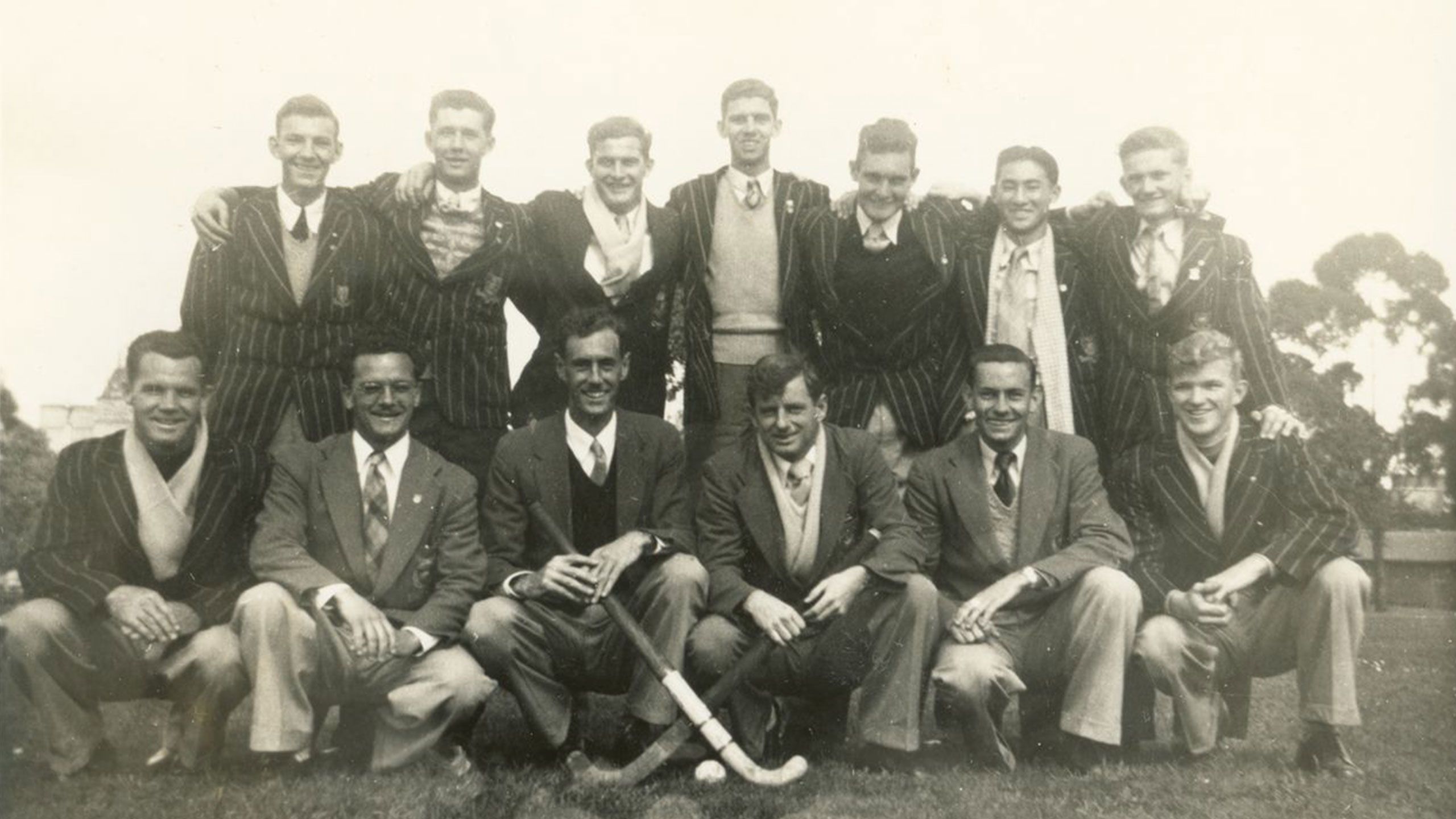 An image of the intervarsity Queensland hockey team after winning the Syme Cup in 1953.