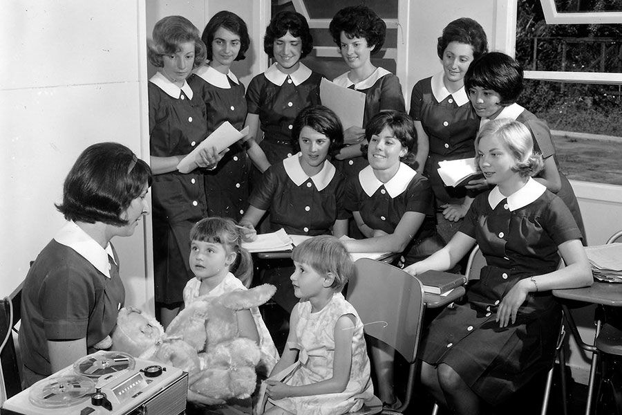 An image of speech therapy students working with children in 1965.