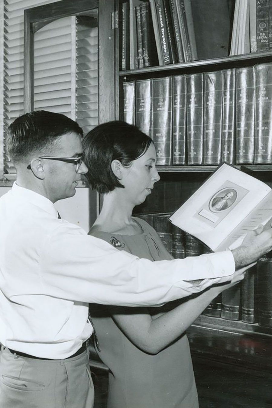 An image of Spencer Routh and Madeleine McPherson in the Main Library in 1960.