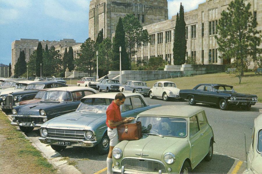 An image of a man parking his car outside the Forgan Smith building, ahead of a day at university in 1965.
