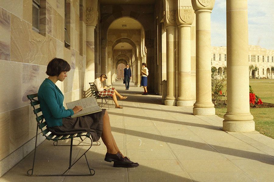 An image of students looking over their notes in the cloisters of the Great Court in 1963.