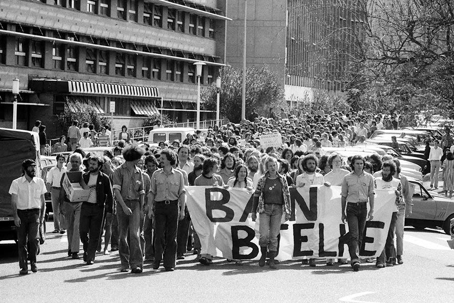 An image of Students taking part in a large protest in 1977. Following Prime Minister Malcolm Fraser's decision that year to expand uranium mining, an anti-uranium protest group was formed. Premier Joh Bjelke-Petersen went on to outlaw street marches, sparking a number of confrontations. However, the "right to march" quickly became the main issue for both the marchers and the police.