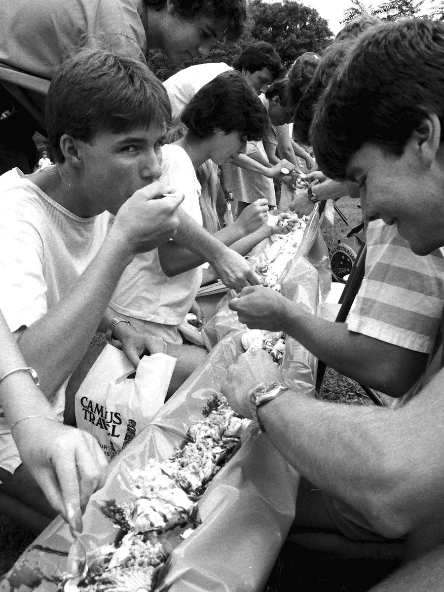 An image of people eating together during Orientation Week in 1984.