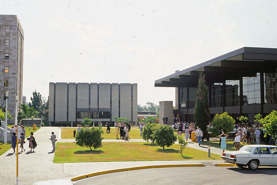 An image of friends and families of students gather for a graduation ceremony at Mayne Hall in 1984.