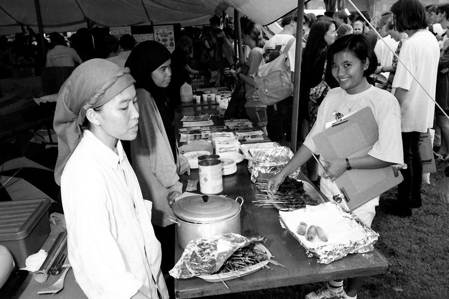 An image of Students lining up for food stalls at UQ during O-Week in 1991.