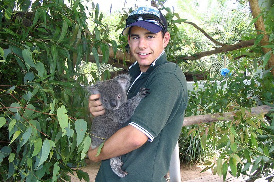 UQ graduate Andrew Howe with a koala at UQ's Gatton campus in 2008. Andrew graduated with a Bachelor of Applied Science (Wildlife Biology and Conservation and Park Management).
