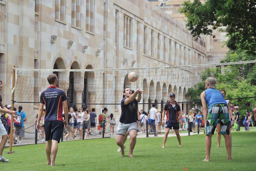 An image of students playing volleyball in the Great Court at the St Lucia campus in 2010.