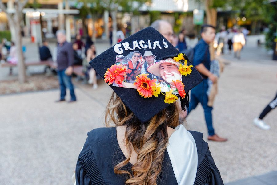 An image of a girl with a decorated graduation cap from July 2018.