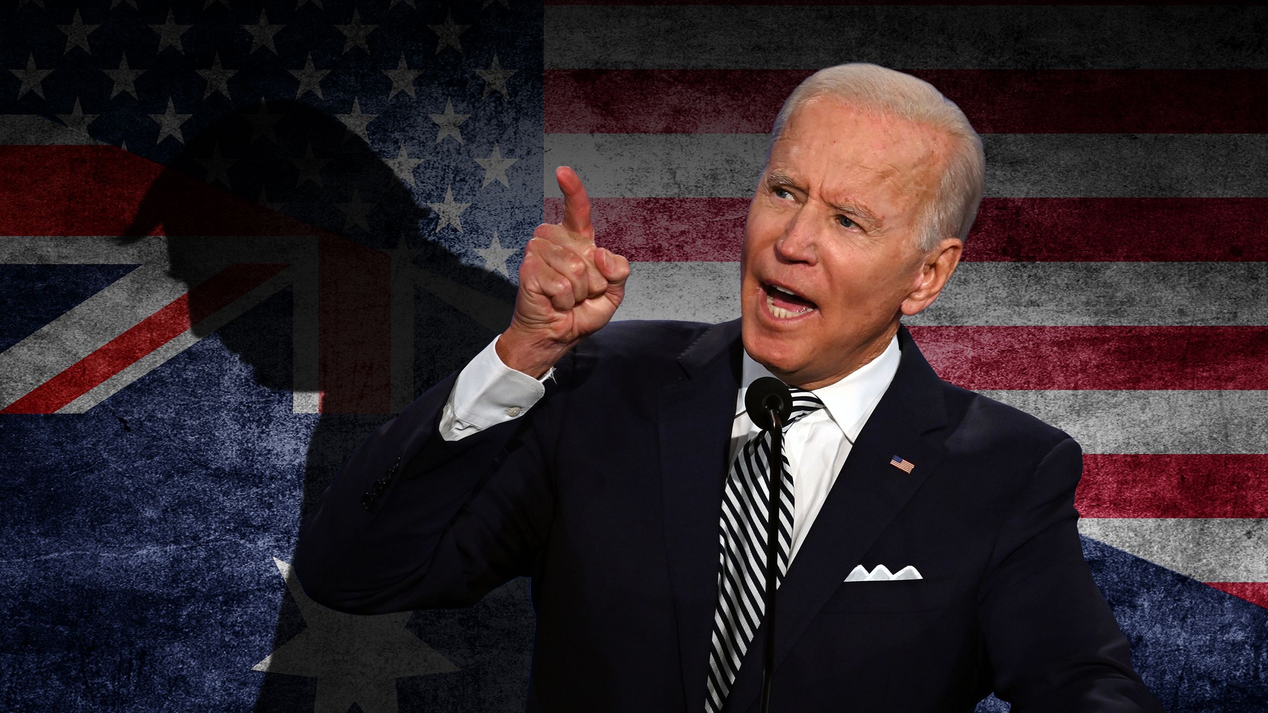 Joe Biden speaking during a debate with the shadow of Donald Trump behind him