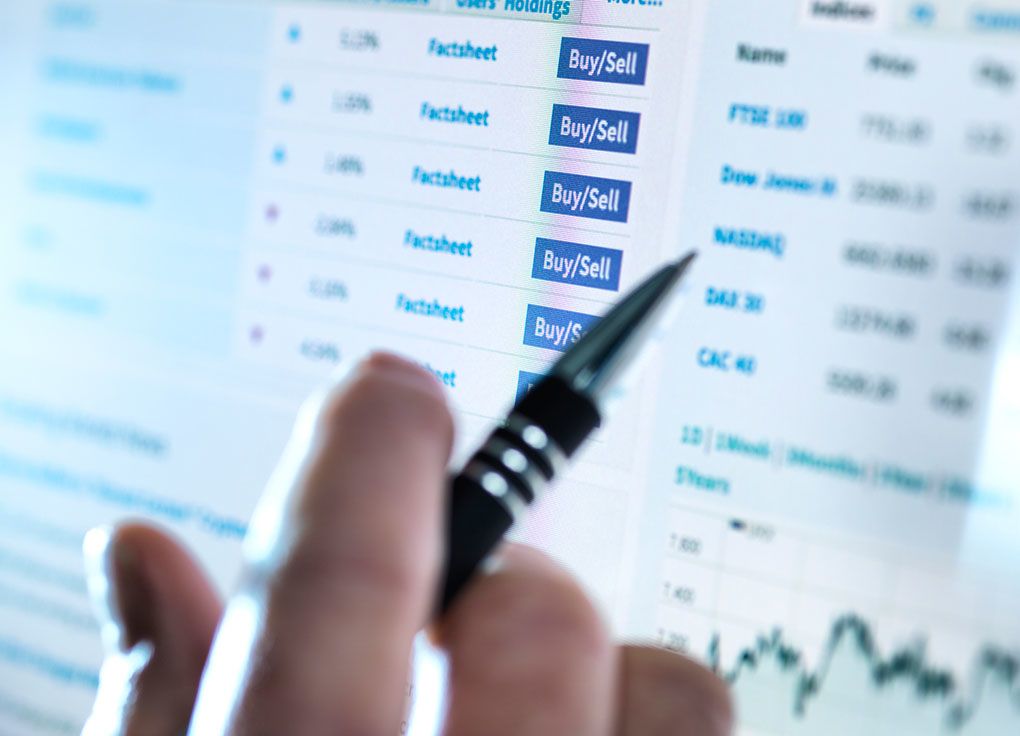 An image of a person analysing the share market on a computer screen.