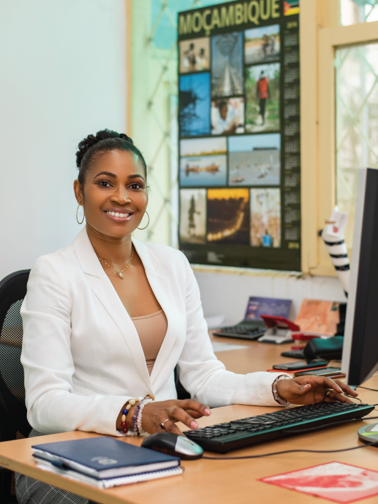 An image of UQ International Alumnus of the Year award recipient Fauna Ibramogy (Master of Agribusiness, 2013) sitting at her desk and working on her computer.