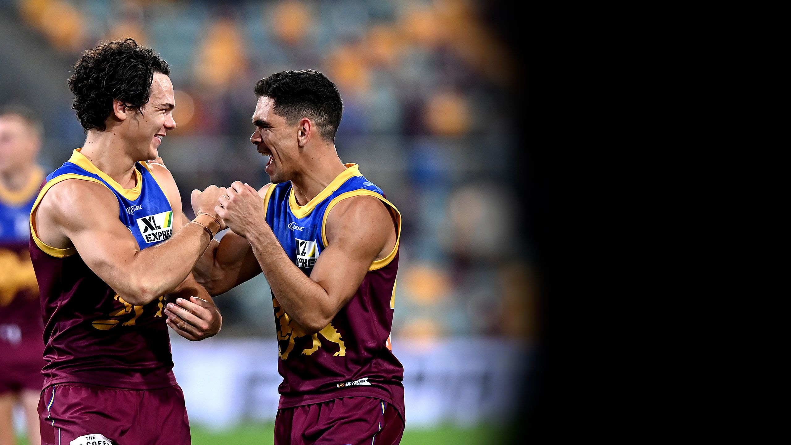 An image of Brisbane Lions players Cam Rayner and Charlie Cameron celebrating a win over Collingwood at The Gabba.