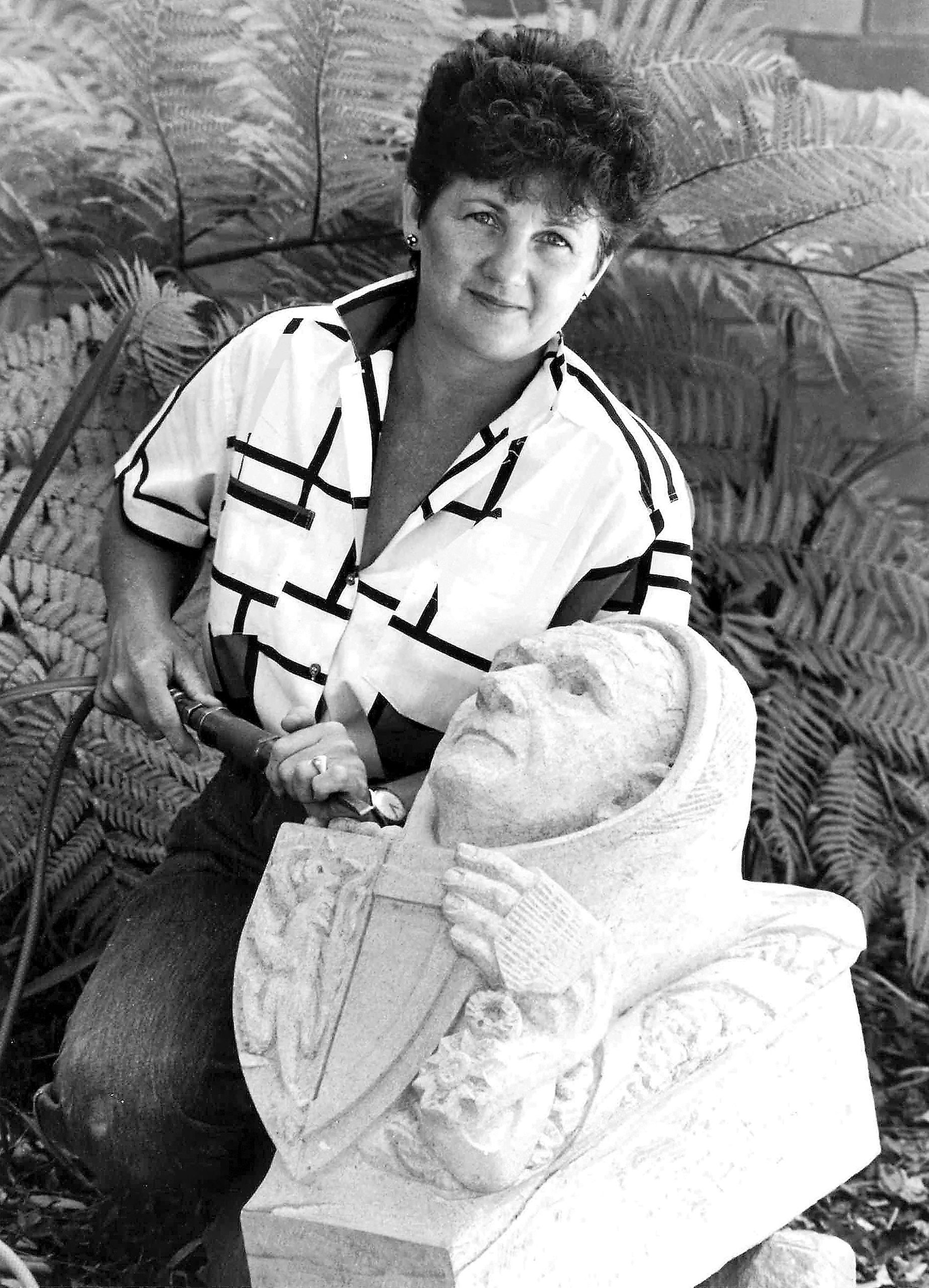 Rhyl Hinwood carving a grotesque of James Mahoney
