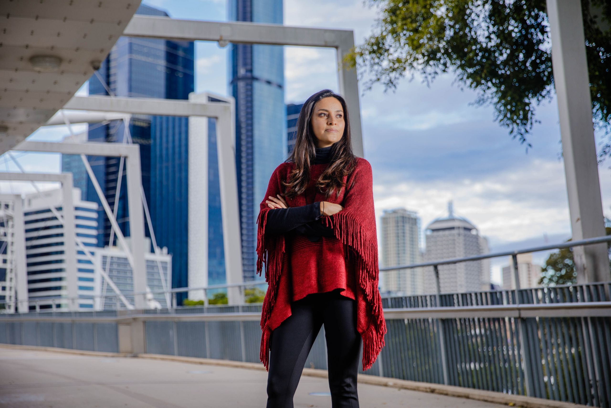 An image of UQ researcher Dr Astrid Rodriguez-Acevedo standing on the Kurilpa Bridge in Brisbane.