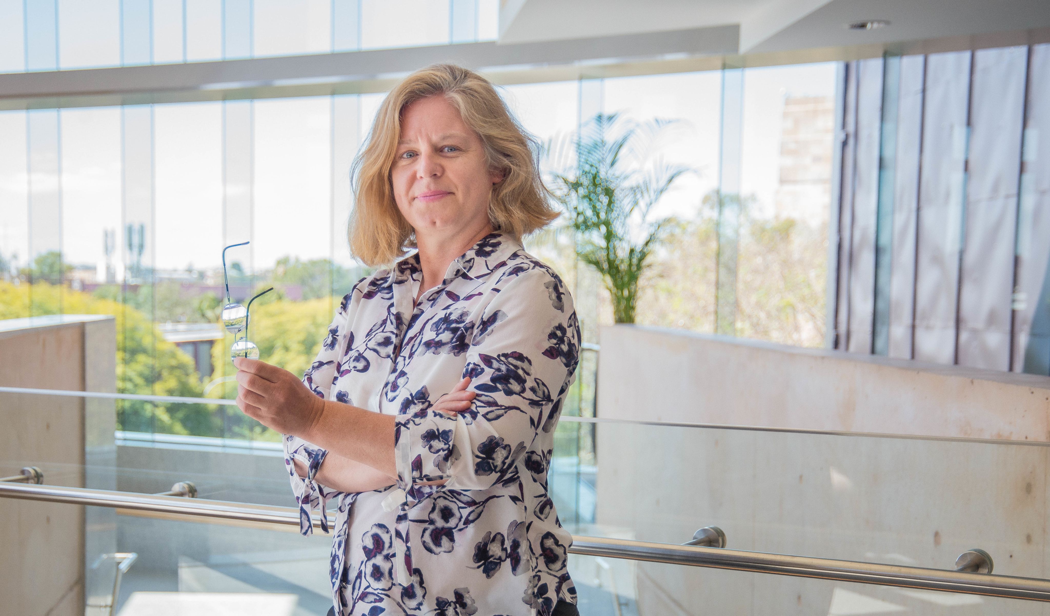 Dr Sabine Matook standing in the foyer of the Sir Llew Edwards building