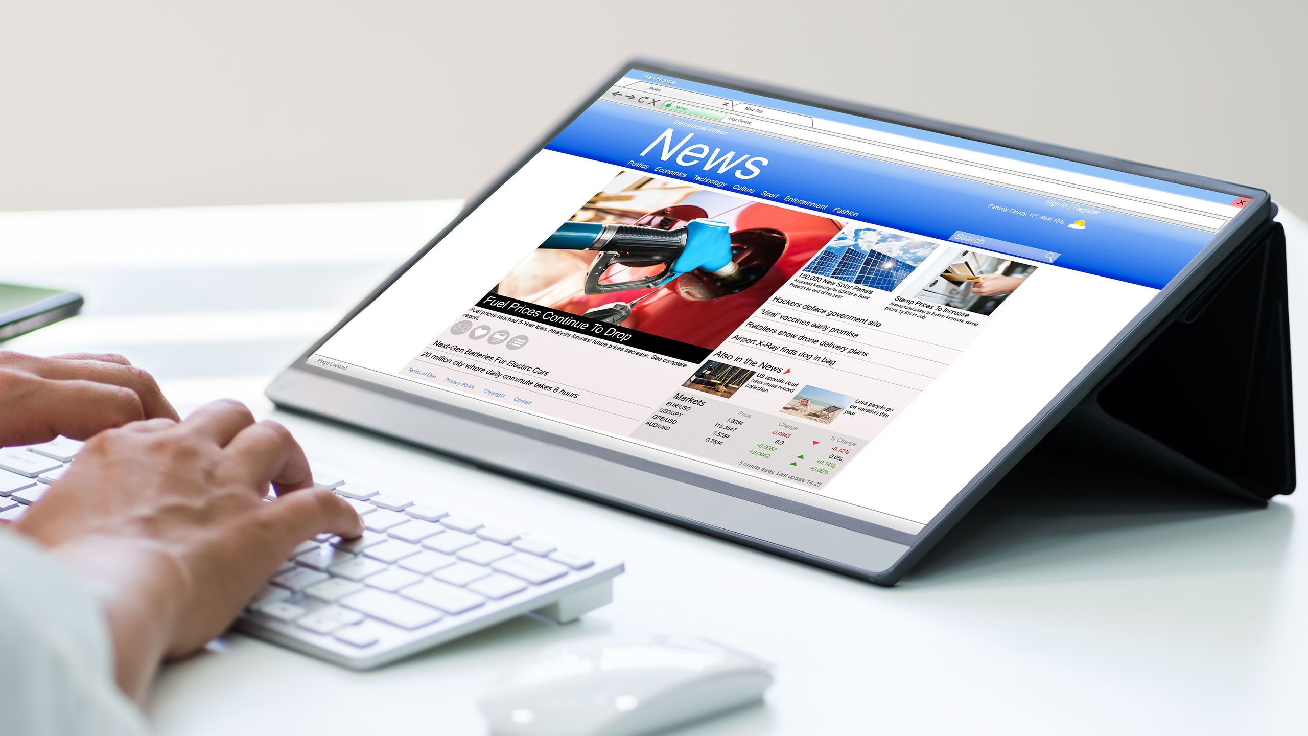 An image of someone reading the news on an iPad.