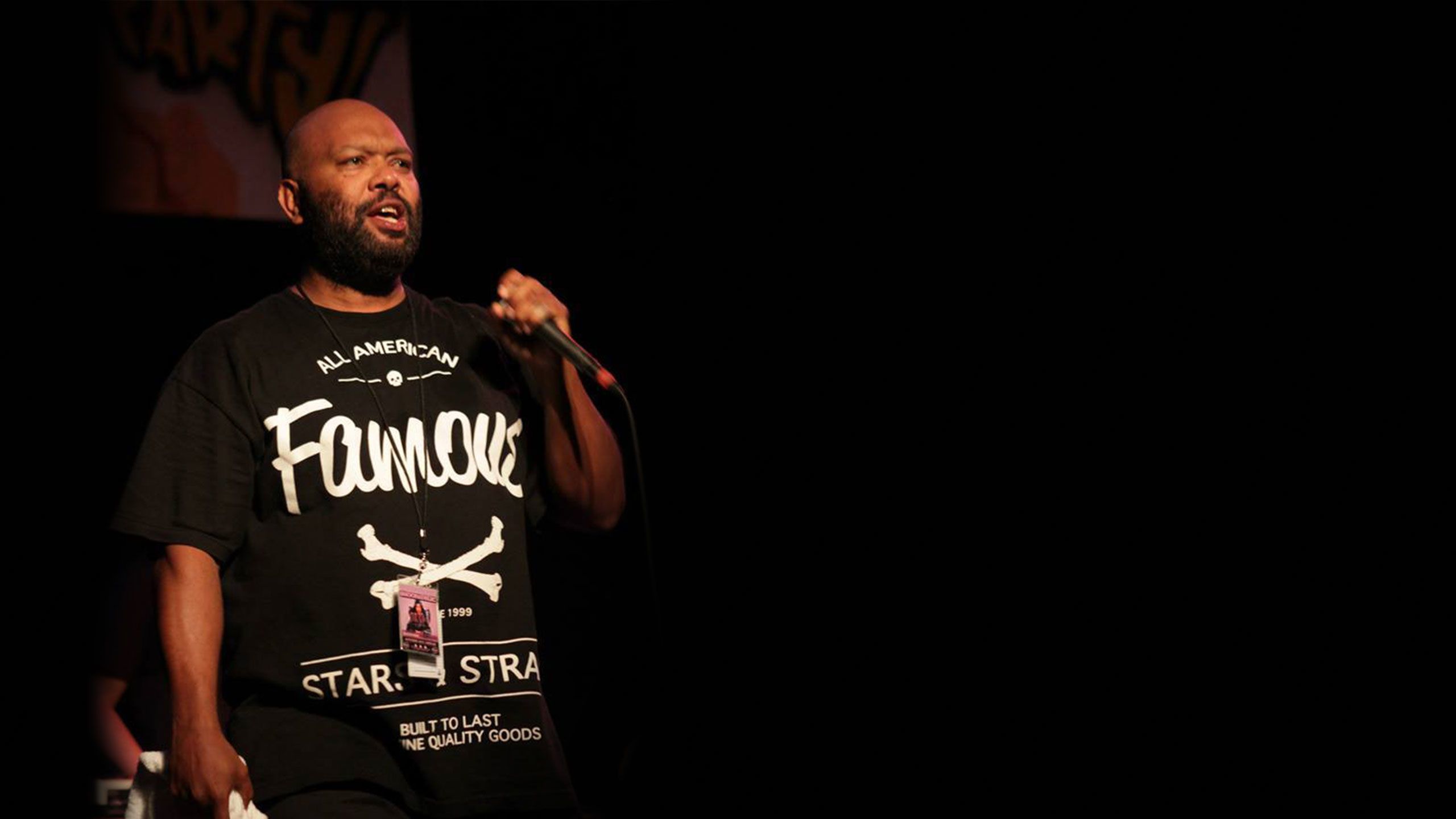 An image of Cameron Callope on stage during a Snoop Dogg tour in 2014.