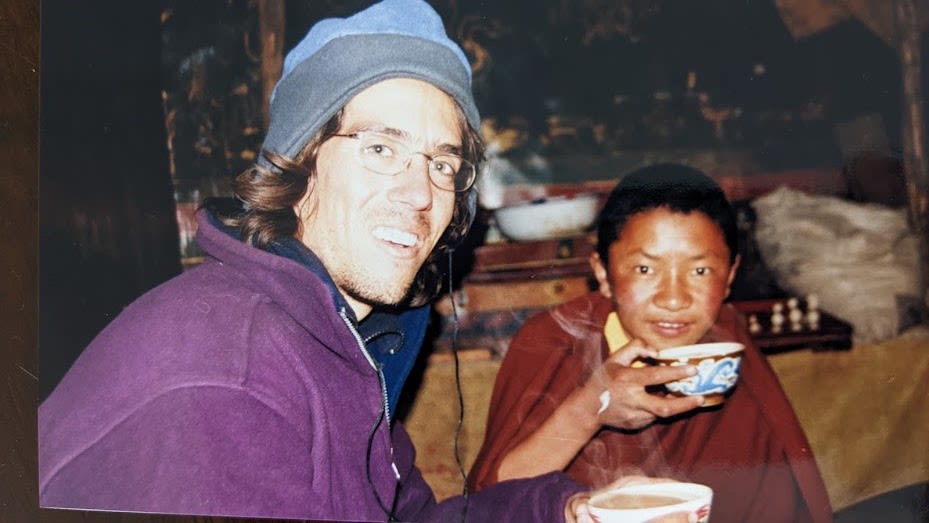 Nimrod sharing a meal with a friend in Peru.