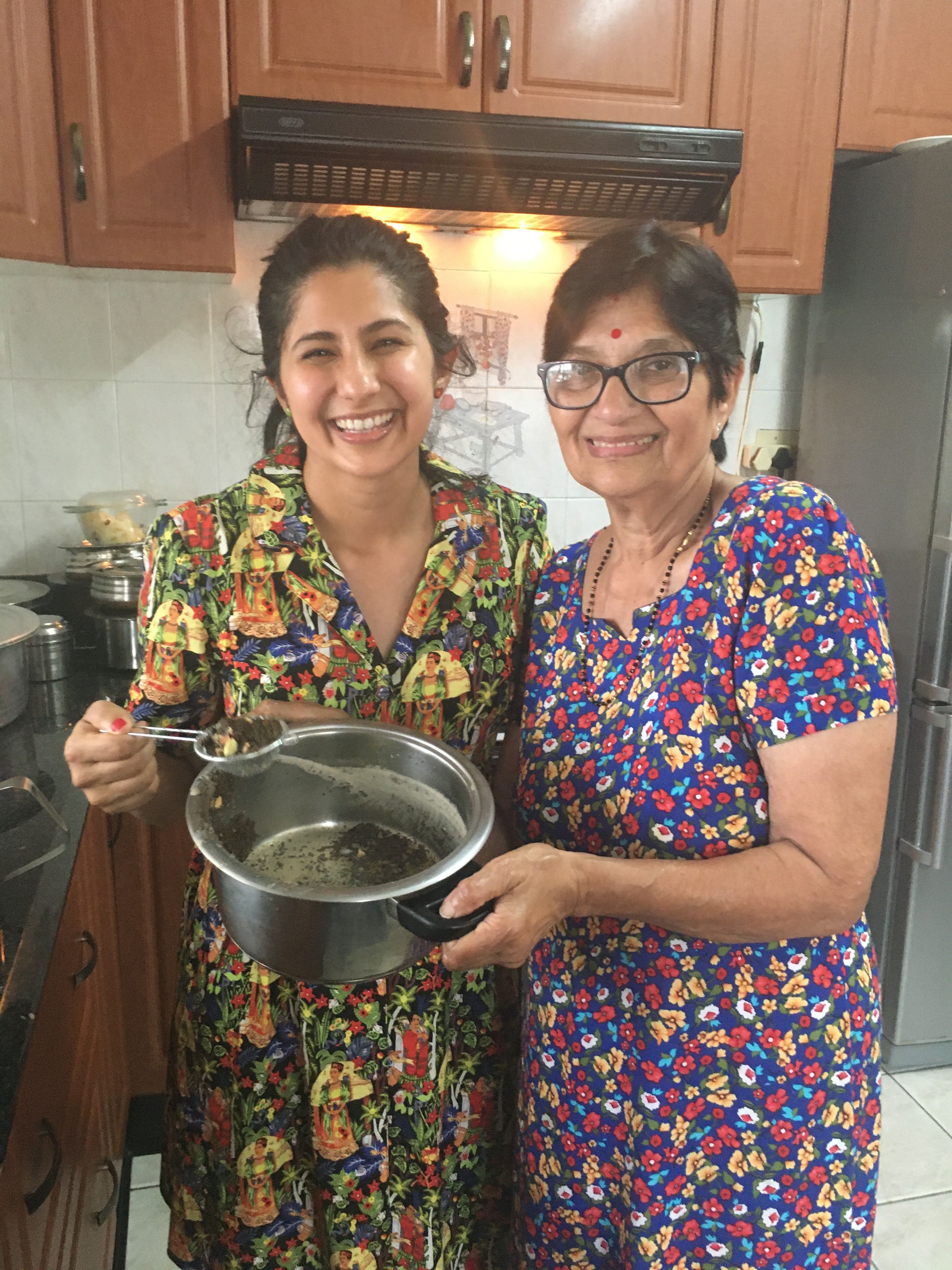 Mikhara and her grandmother in the kitchen.