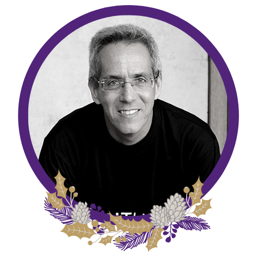 Black and white image of Nimrod Klayman. The image has a purple circular border with a purple and gold native wreath at the bottom.
