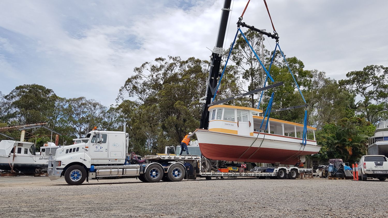 The ferry is being moved onto the back of a truck for transport back to  UQ St Lucia.