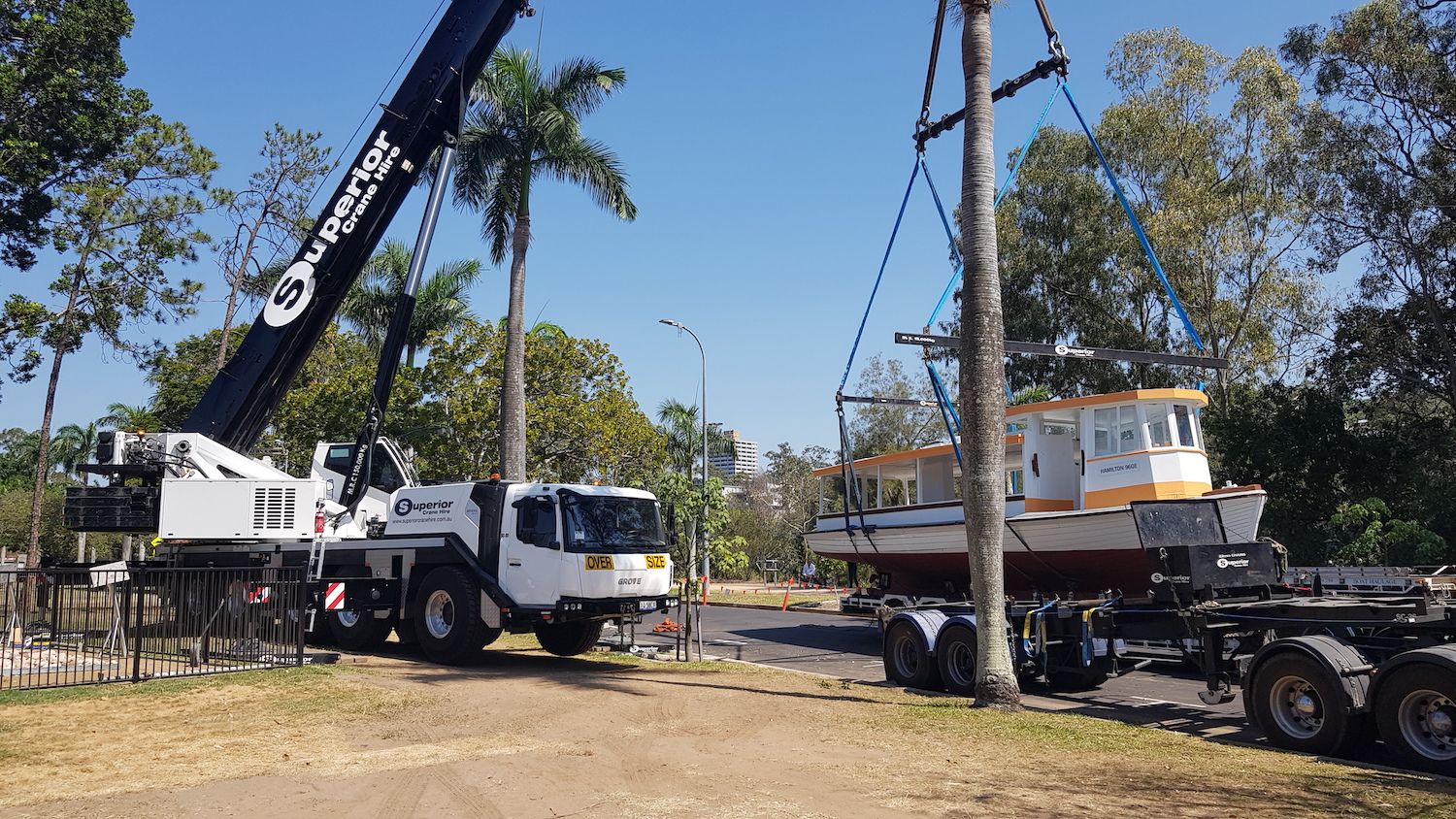 The ferry being craned onto the back of a truck for transport.