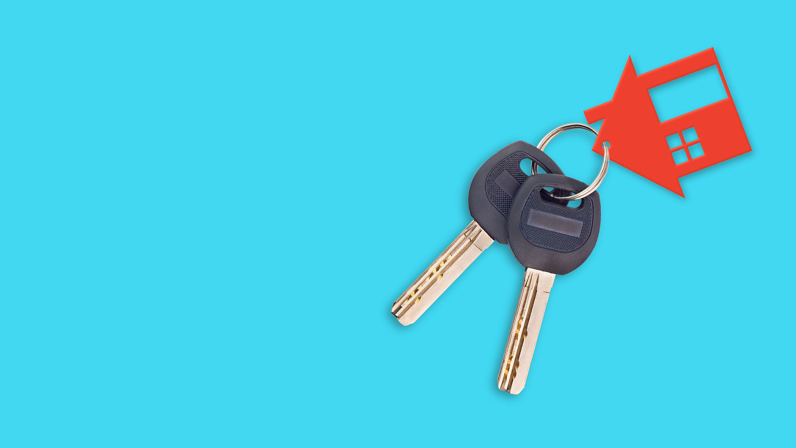 Two keys on metal ring and one red plastic house with window and door on blue table.