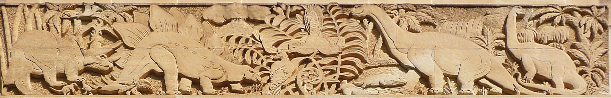 A frieze of dinosaurs at UQ St Lucia.