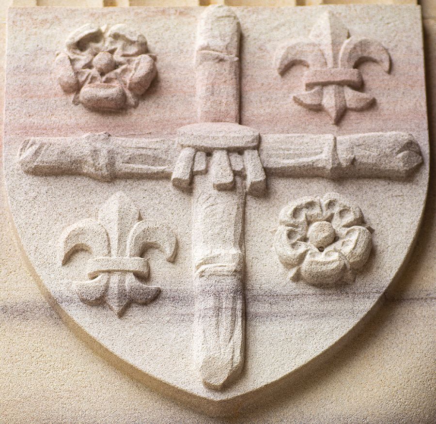 Full-shield carving of the Island of St Lucia coat of arms.