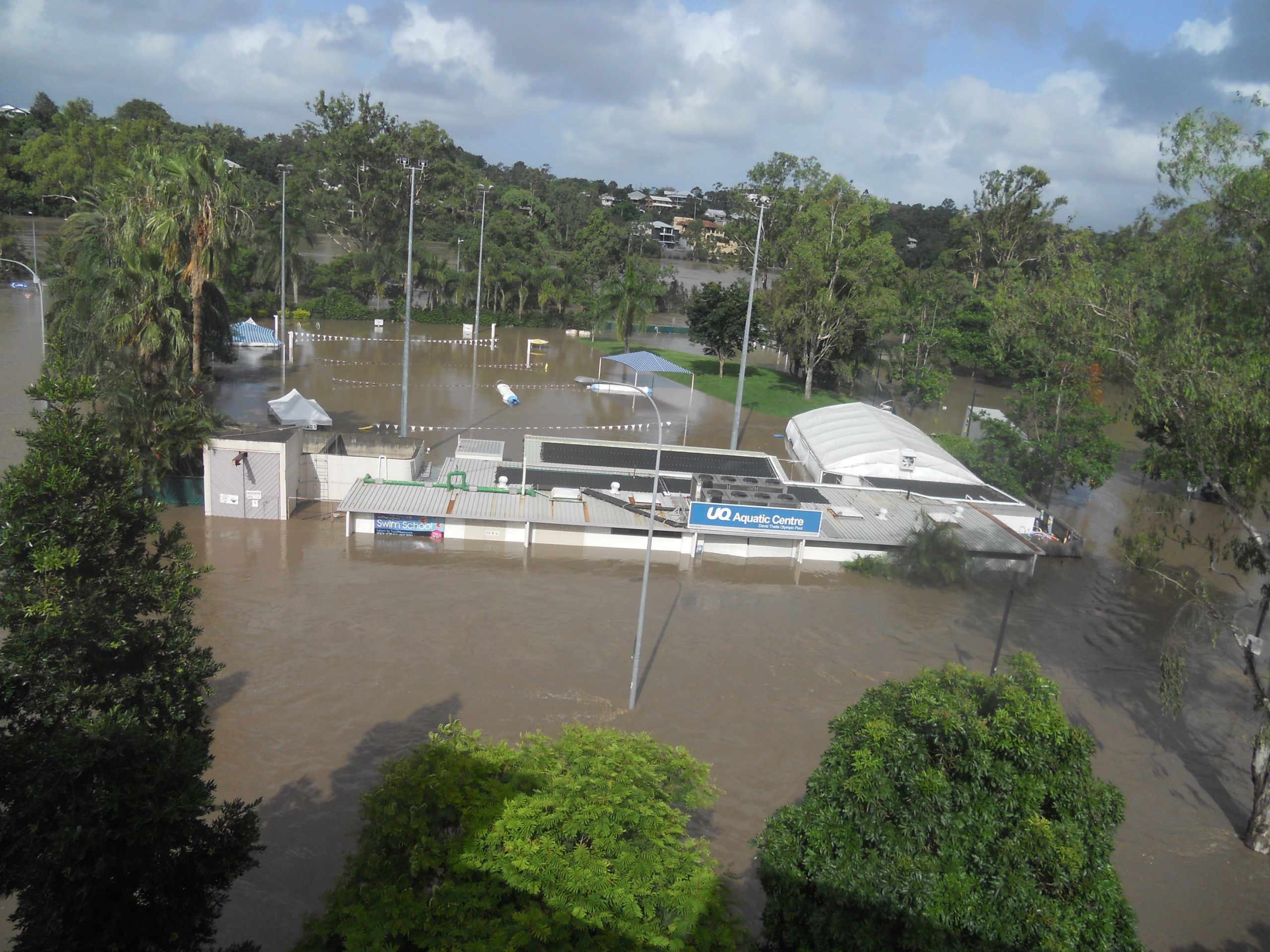 An image of flood water swamping the UQ Aquatic Centre.