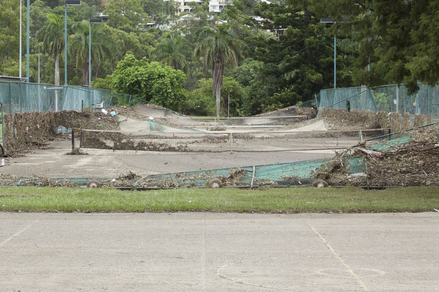 An image the mud and destruction on the UQ tennis centre.