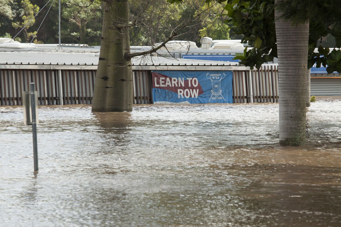 An image showing water almost reaching the roof of the UQ Boat Club.